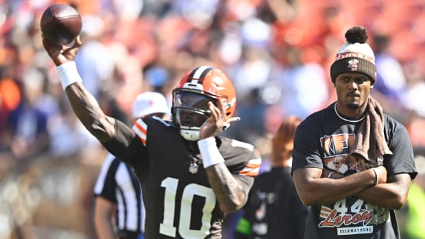 Oct 1, 2023; Cleveland, Ohio, USA; Cleveland Browns quarterback Deshaun Watson (right) watches quarterback PJ Walker (10) warm up before a game against the Baltimore Ravens at Cleveland Browns Stadium. Mandatory Credit: David Richard-USA TODAY Sports